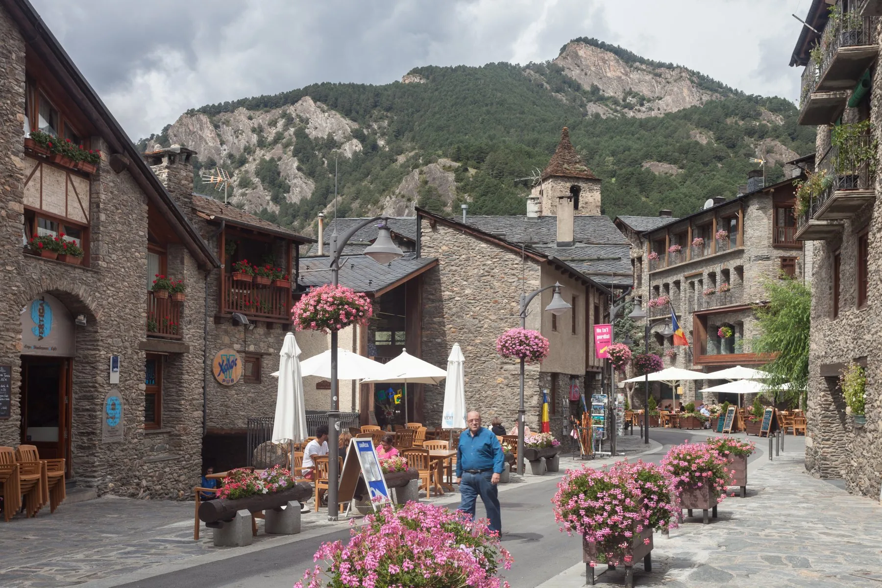 Flowered terrace and stone alley in the village of Ordino Flowered terrace and stone alley in the village of Ordino