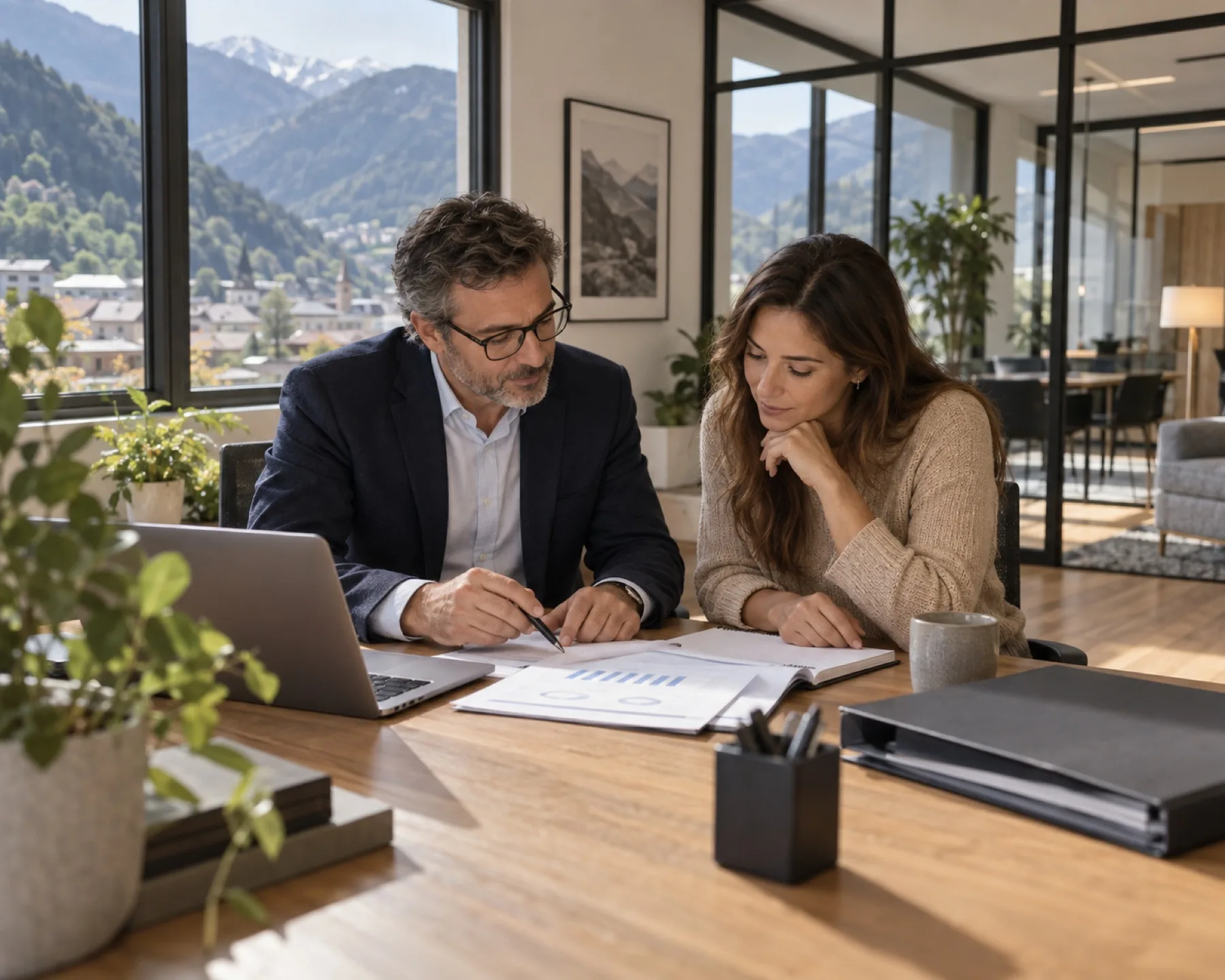 An entrepreneur reviews his figures with his accounting advisor in Andorra An entrepreneur reviews his figures with his accounting advisor in Andorra